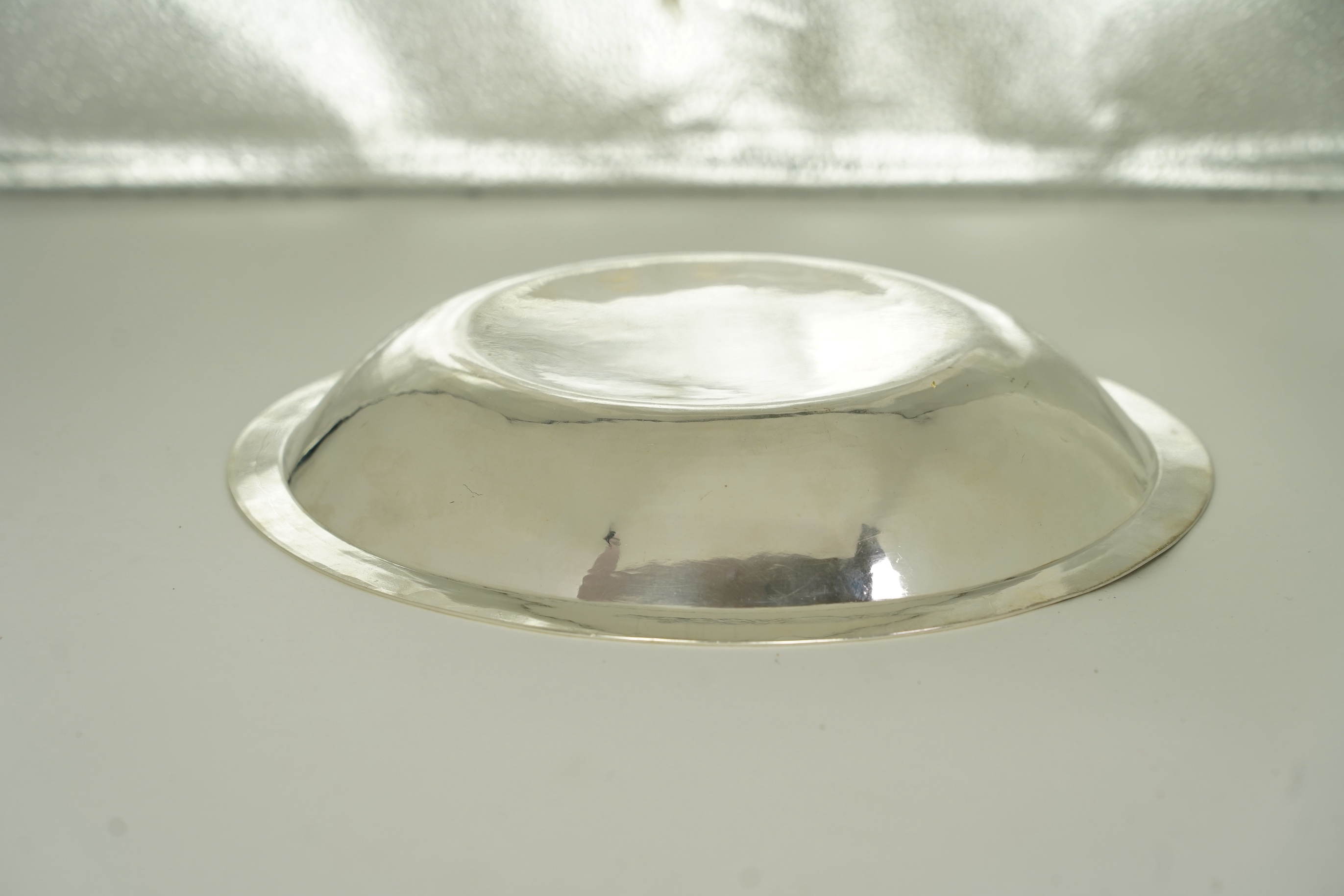 A rare late Charles II silver circular deep plate, makers mark 'D' (Jackson's reference P.139)